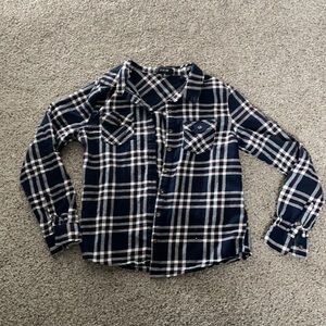 Button-front plaid shirt. Black/white/red. Light flannel material.